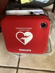 Phillips Heart Start Defibrillator And Wall Mount. Fixed Price $550.00.